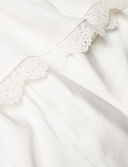 by malina leone gown