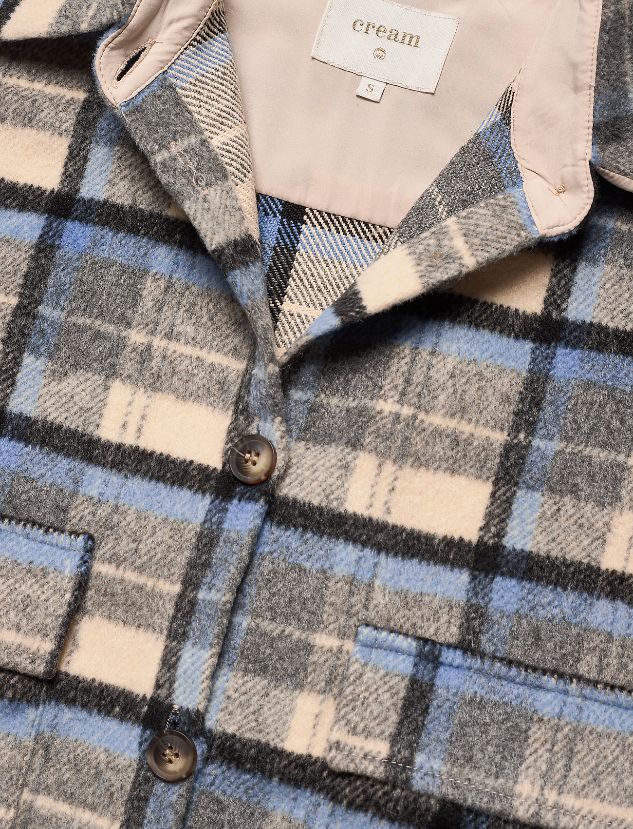 navy and cream jacket