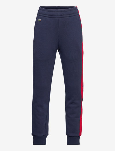 TRACKSUITS & TRA - sweatpants - navy blue/infrared